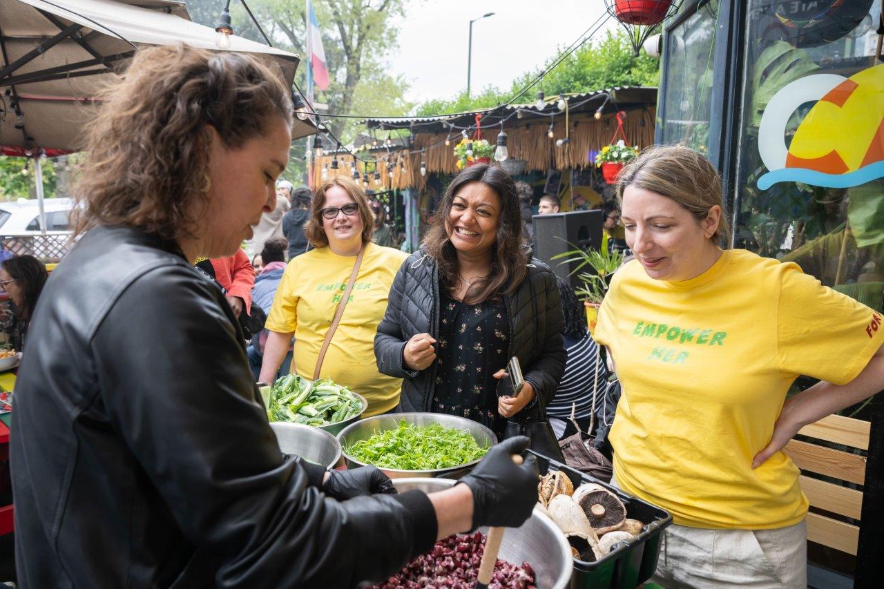 Women conversating at food stall